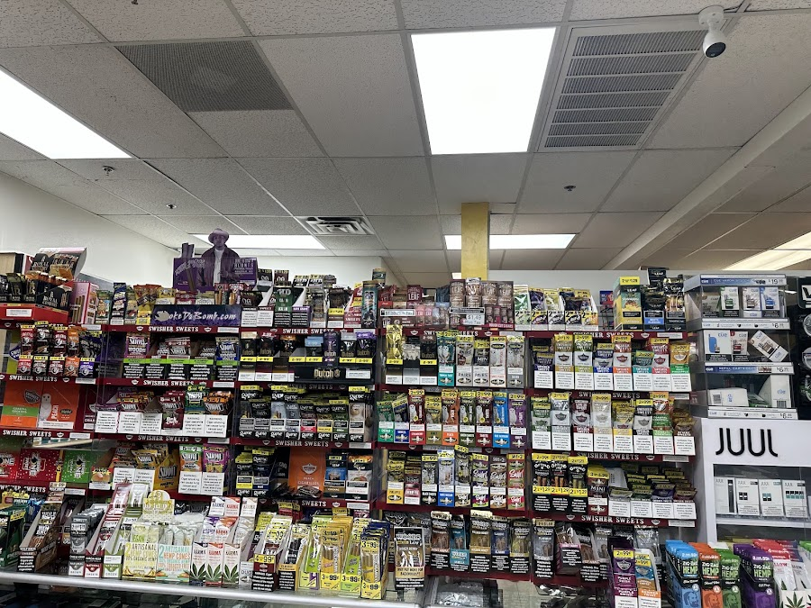 Wall of cigars, Swisher Sweets, and wraps at Discount Cigarettes +