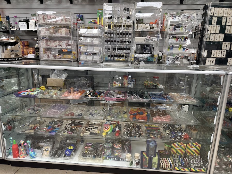 Display case of pipes, grinders, and smoking accessories